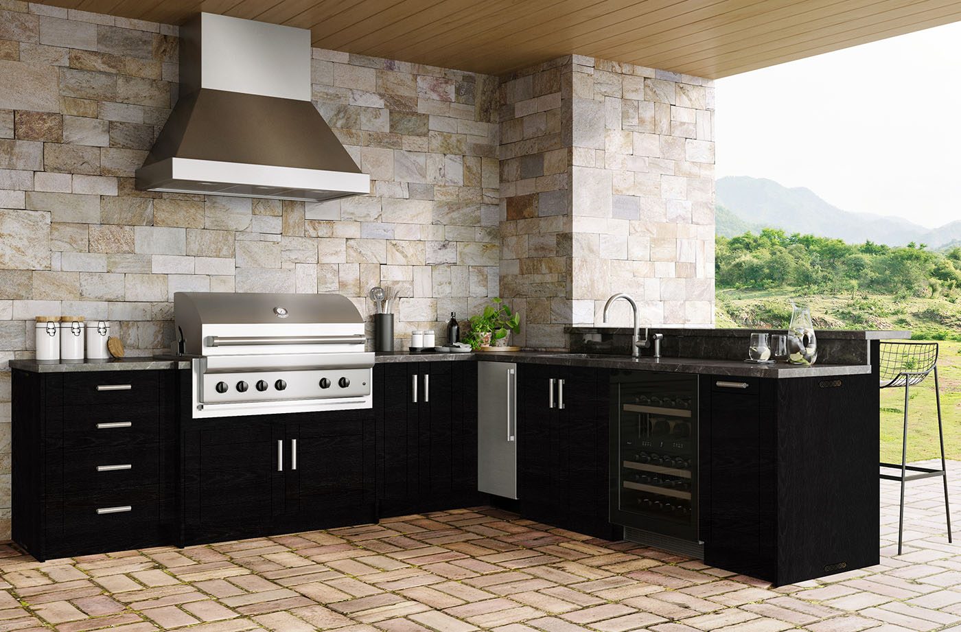 Built-in grill cabinet with stone surround in a South Florida outdoor kitchen