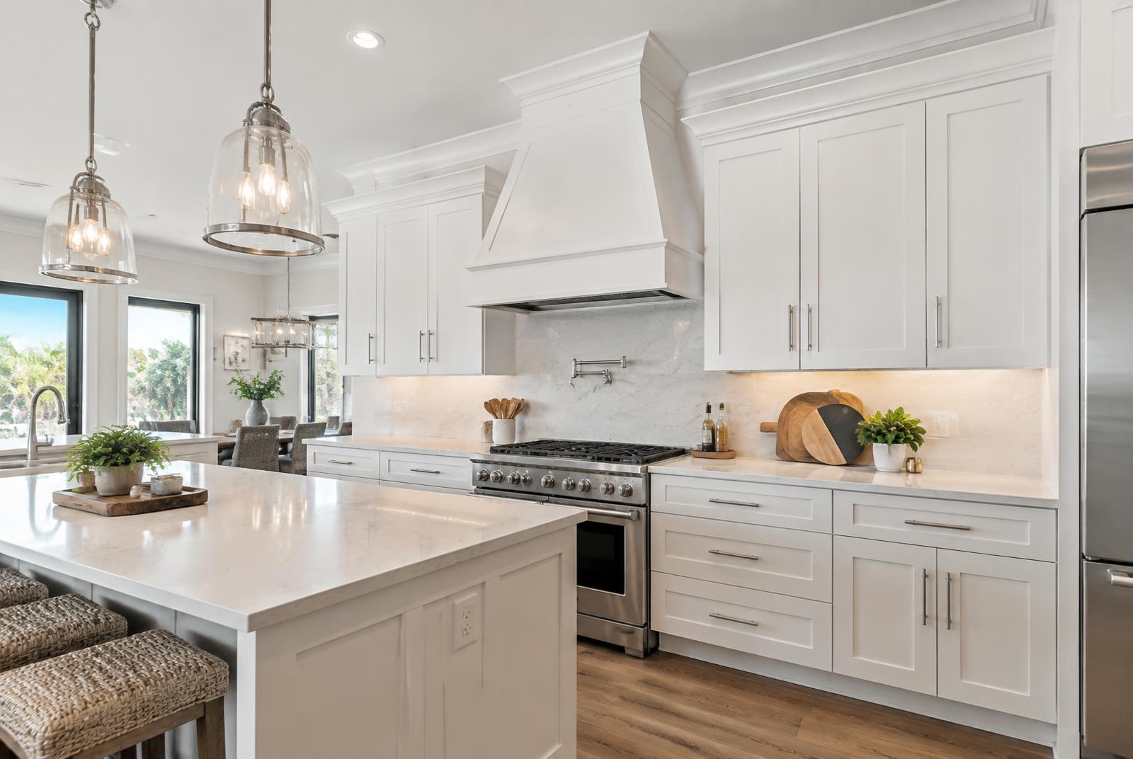 Wood range hood over kitchen cabinets in West Palm Beach